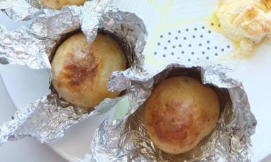 Whole potatoes baked in the oven in foil